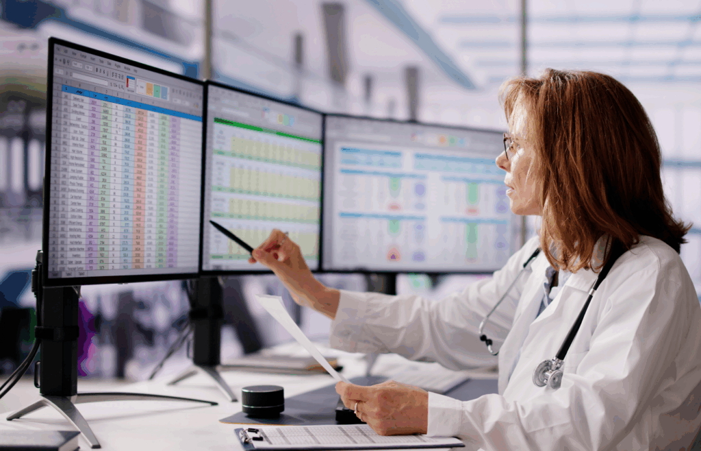 Surgical scheduling team monitoring cases with SmarTrack Next OR Timeline View